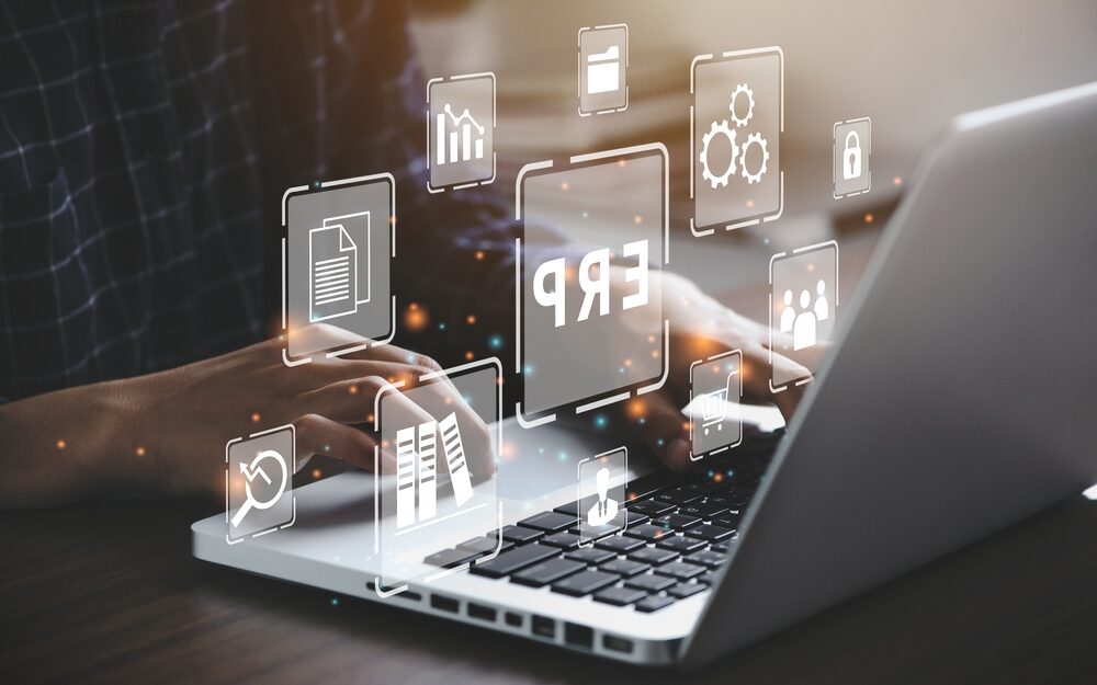 Businessman,Using,A,Computer,To,Document,Management,For,Erp.,Enterprise